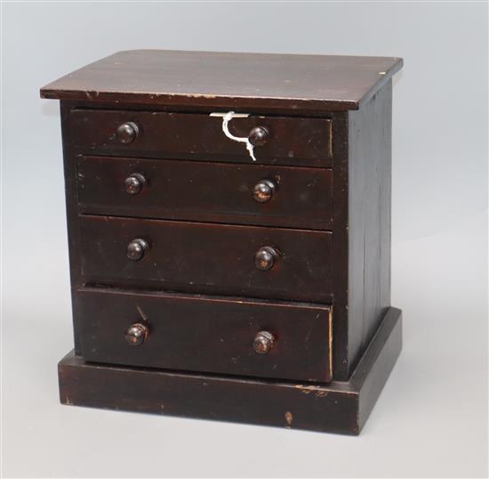 A Victorian miniature pine specimen chest height 32cm